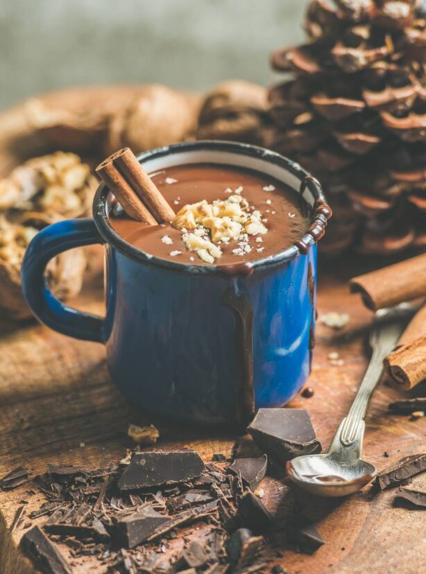 Rich winter hot chocolate with cinnamon and walnuts, square crop